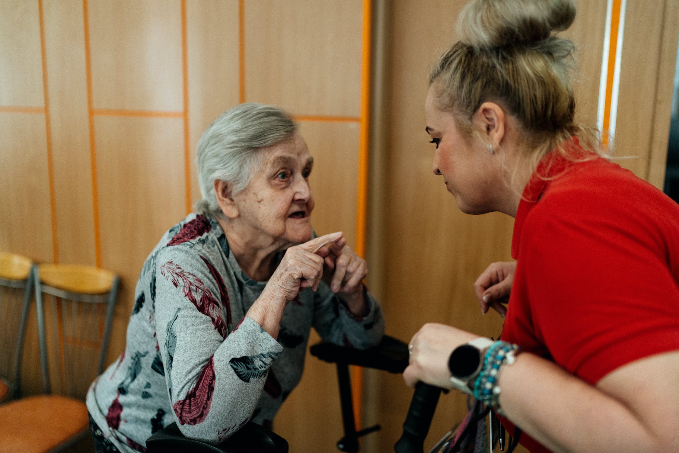 Family Care Homes are small family-style homes that provide assisted living for seniors and the disabled. Here a caregiver and resident enjoy a chat together